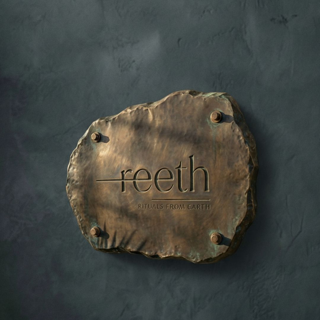 Bespoke solid brass signage and branding elements for luxury retail, hotels, and corporate environments.