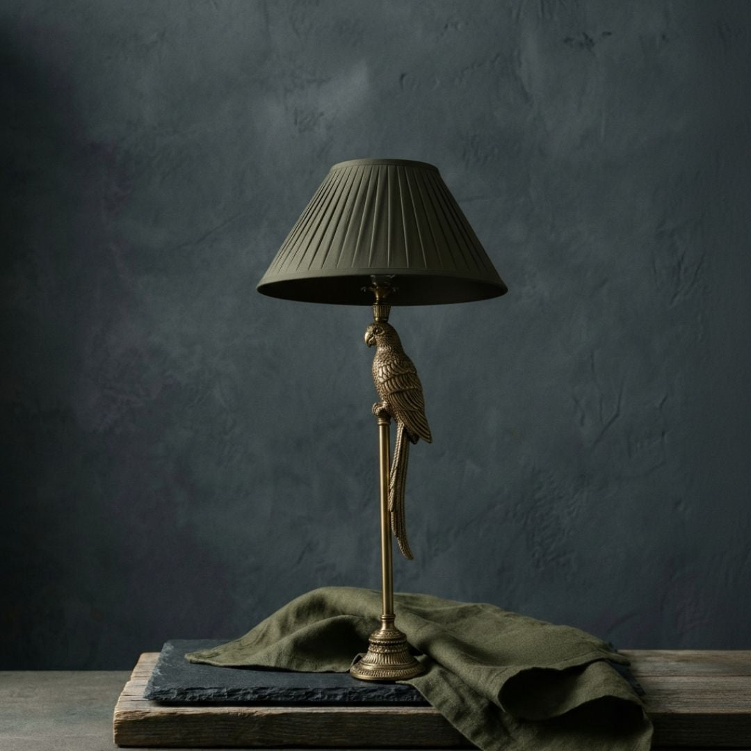 Designer solid brass table lamps featuring architectural silhouettes and hand-polished luster.