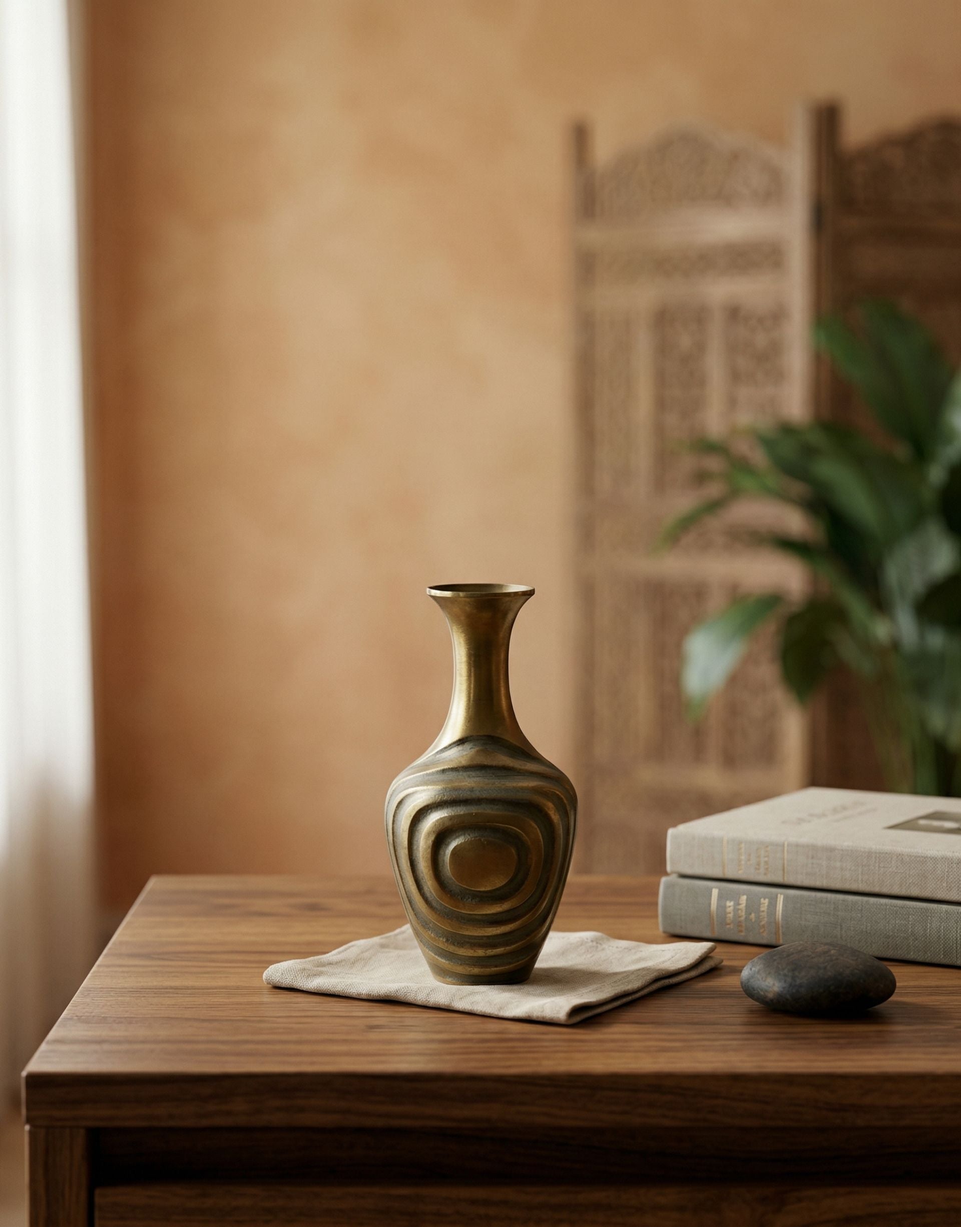 Brass vase on a wooden table with a blurred background
