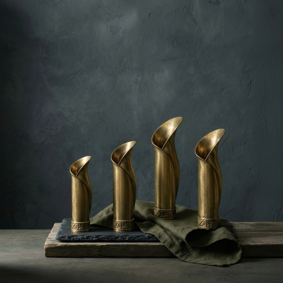 Substantial, handcrafted solid brass vases designed as heirloom-quality focal points for modern interiors.